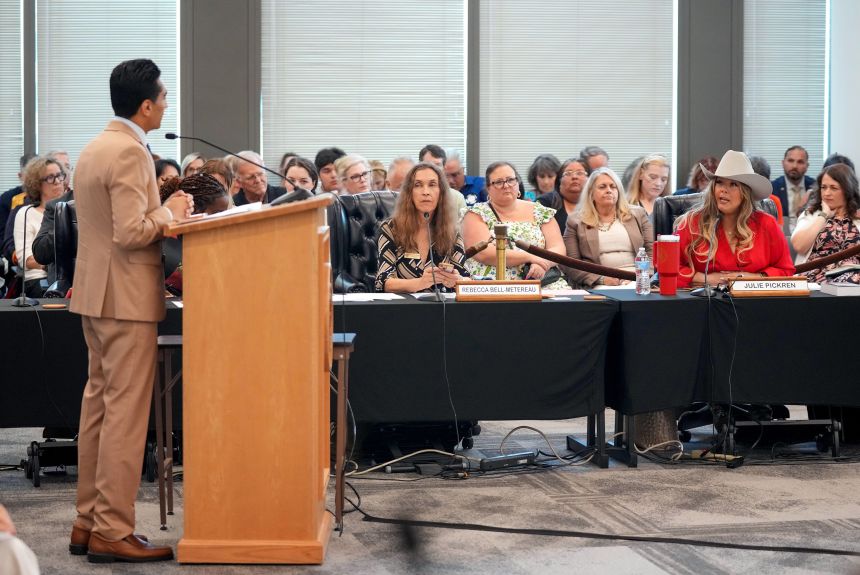 State Board of Education member Julie Pickren, right, questions Democratic State Rep. Salman Bhojani during a meeting on proposed social studies standards on June 22.