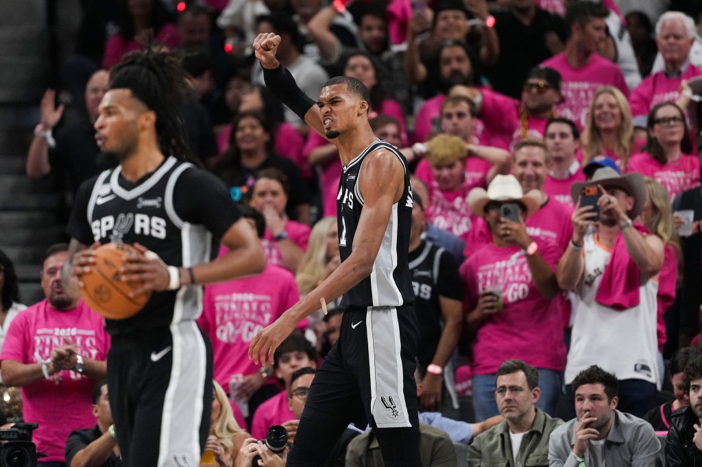 San Antonio Spurs forward Victor Wembanyama celebrates a basket.