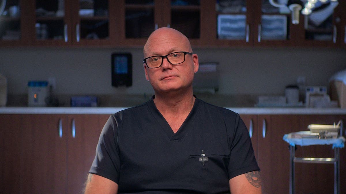 Dr. Christopher Mason sitting during an interview for Maternal Instinct