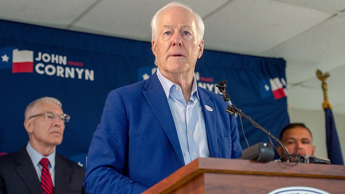 John Cornyn at a podium at a campaign event