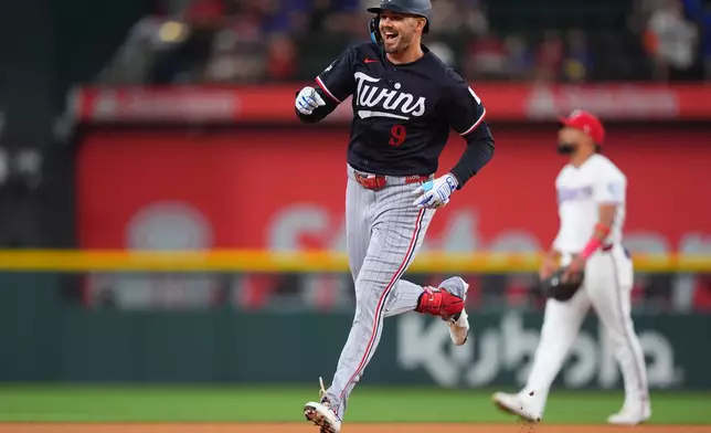 Minnesota Twins' Trevor Larnach runs the bases after hitting a home run during the first inning of a baseball game against the Texas Rangers, Tuesday, June 16, 2026, in Arlington, Texas. (AP Photo/LM Otero)