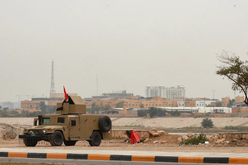 An Iraqi army Humvee stands guard near the U.S. Embassy, after Iraqi security sources said the embassy was hit in a missile attack, in Baghdad, Iraq, March 14, 2026.