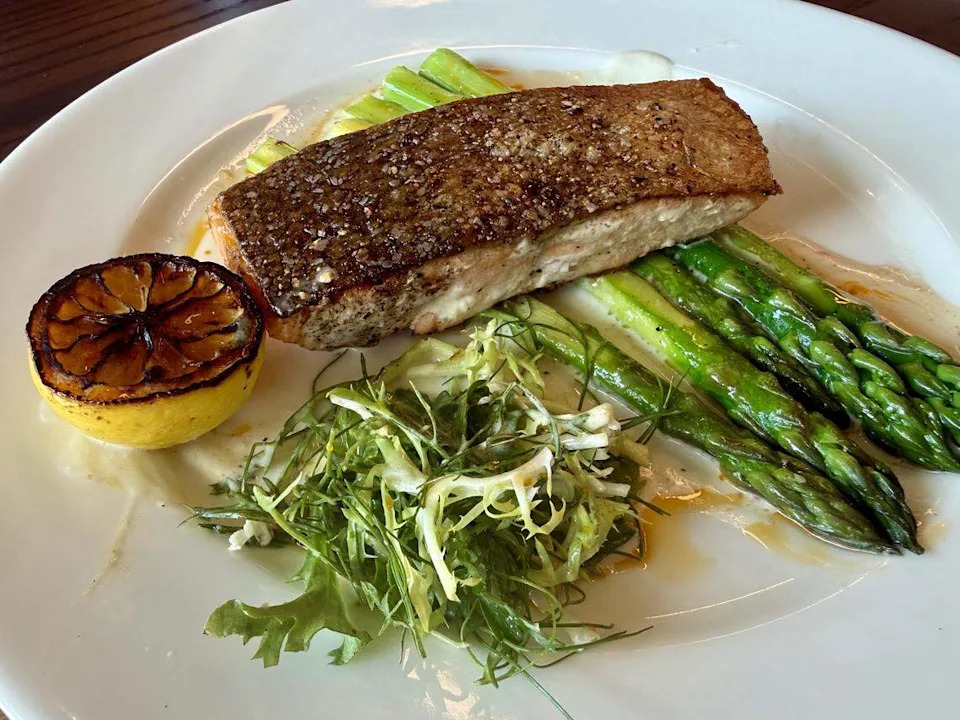Salmon in yuzu butter at The Vandy restaurant inside the Caravan Court Hotel, Valencia Hotel Collection in Arlington, Texas, as seen June 1, 2026.