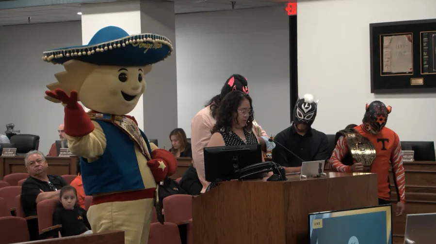 Members of the Lucha League, along with the Amigo Man, express their thanks to the El Paso County Commissioners’ Court for the resolution for the Viva La Lucha 5K race. Photo taken by Tony Pina/KTSM