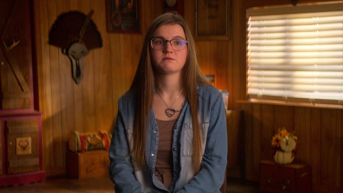 Emily Shirey standing in a scene from Maternal Instinct.