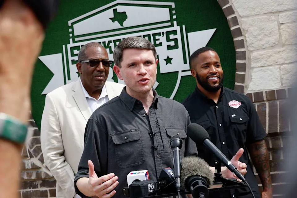 Democratic Senate candidate James Talarico, center, speaks during a campaign event at Smokey Joe’s BBQ, with state Sen. Royce West, left, and Kris Manning, owner of Smokey Joe’s BBQ. (Chitose Suzuki/The Dallas Morning News)