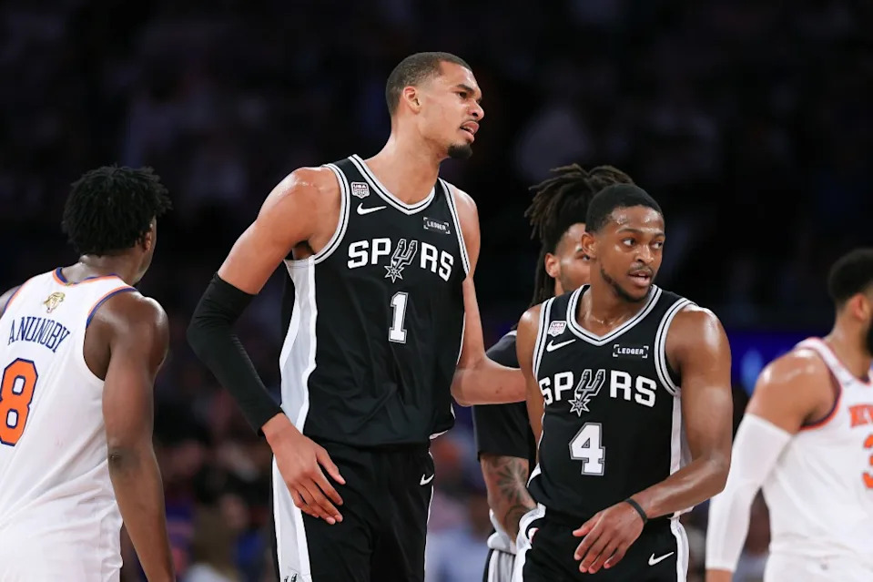 NEW YORK, NEW YORK – JUNE 08: Victor Wembanyama #1 of the San Antonio Spurs and <a class="link " href="https://sports.yahoo.com/nba/players/5767/" data-i13n="sec:content-canvas;subsec:anchor_text;elm:context_link" data-ylk="slk:De’aaron Fox;sec:content-canvas;subsec:anchor_text;elm:context_link;itc:0" data-yga="{"yLinkElement":"context_link","yModuleName":"content-canvas","yLinkText":"De’aaron Fox","ySubModuleName":"anchor_text","yHasCommerce":false}">De’aaron Fox</a> #4 of the San Antonio Spurs react during the fourth quarter against the New York Knicks in Game Three of the 2026 NBA Finals at Madison Square Garden on June 08, 2026 in New York City. NOTE TO USER: User expressly acknowledges and agrees that, by downloading and or using this photograph, User is consenting to the terms and conditions of the Getty Images License Agreement. (Photo by Al Bello/Getty Images)