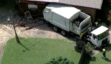 Garbage truck breaks loose while being towed, rolls into Dallas home, authorities say