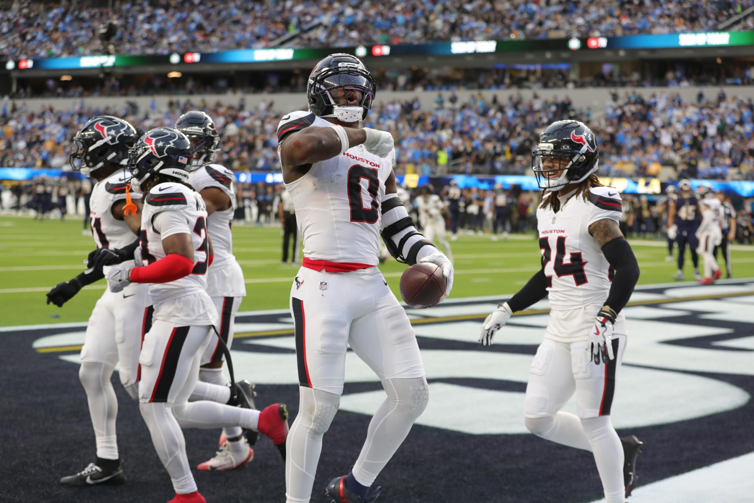 INGLEWOOD, CA - DECEMBER 27: Houston Texans linebacker Azeez al-Shaair (0) celebrates a interception during the Houston Texans vs Los Angeles Chargers NFL game on December 27, 2025, at SoFi Stadium in Inglewood, CA. (Photo by Jevone Moore/Icon Sportswire via Getty Images)