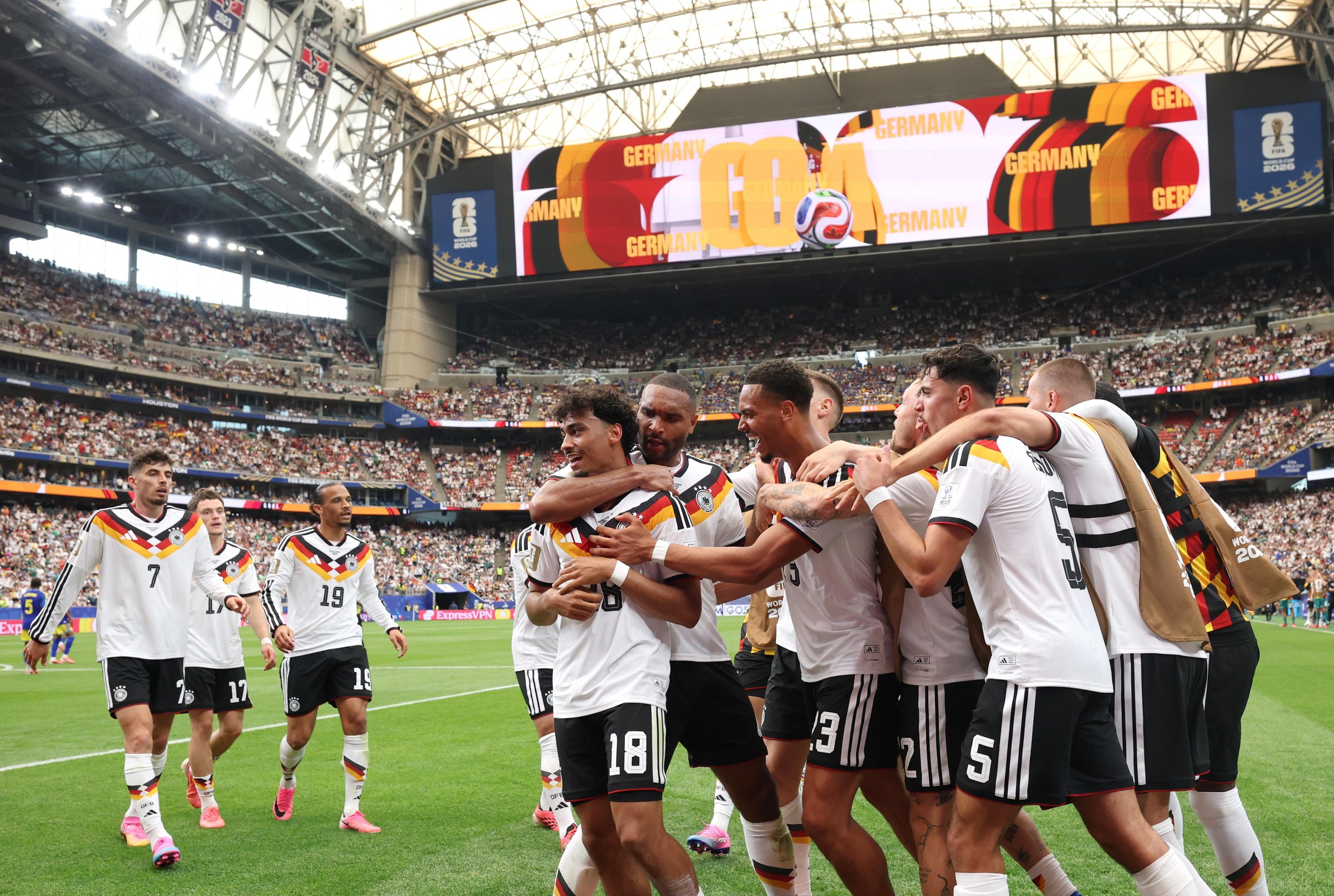 HOUSTON, TEXAS - JUNE 14: Nathaniel Brown #18 of Germany celebrates with teammates after scoring the team’s fifth goal during the FIFA World Cup 2026 Group E match between Germany and Curacao at Houston Stadium on June 14, 2026 in Houston, Texas. (Photo by Alexander Hassenstein/Getty Images)