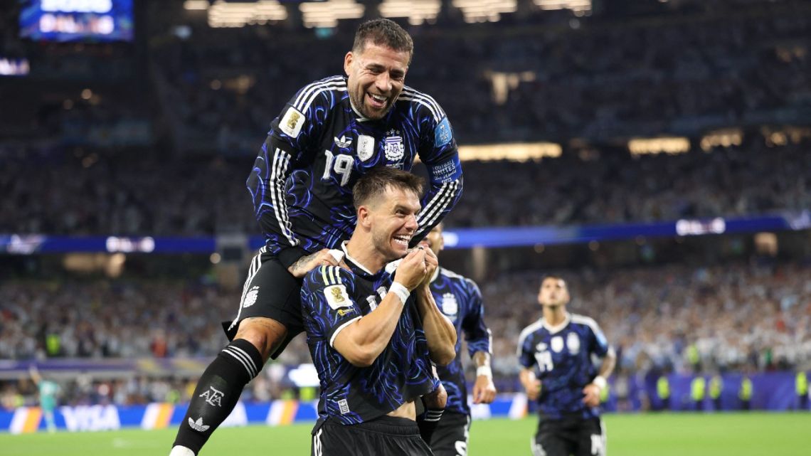 ARLINGTON, TEXAS - JUNE 27: Giovani Lo Celso of Argentina celebrates with teammate Nicolas Otamendi #19 after scoring his team's first goal during the FIFA World Cup 2026 Group J match between Jordan and Argentina at Dallas Stadium on June 27, 2026 in Arlington, Texas.