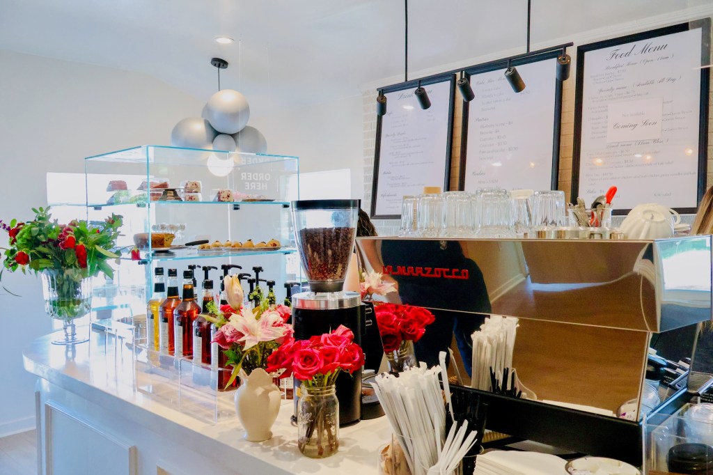 the cafe counter at Alma Cafe with the espresso machine and syrups for drinks. 