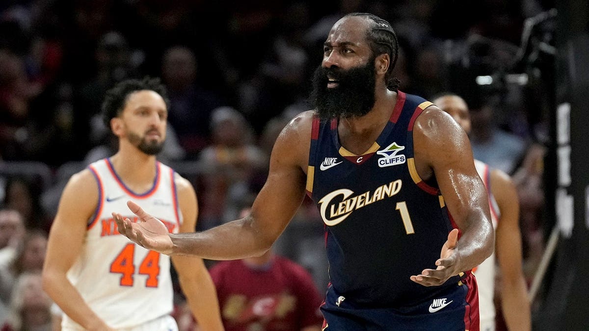 Cleveland Cavaliers guard James Harden disputing a call during a basketball game.