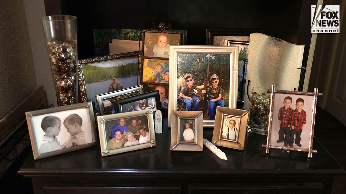 An array of photos and memorabilia honoring Austin Metcalf at Jeff Metcalf's home in Frisco, Texas.