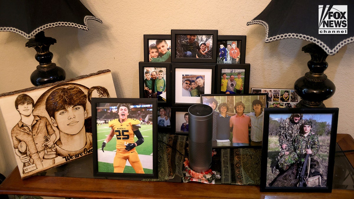 An array of photos and memorabilia honoring Austin Metcalf at Jeff Metcalf's home in Frisco, Texas.