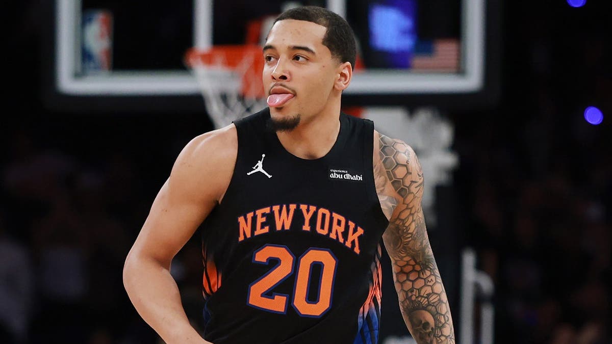 Jeremy Sochan of the New York Knicks dribbling basketball during NBA playoff game at Madison Square Garden
