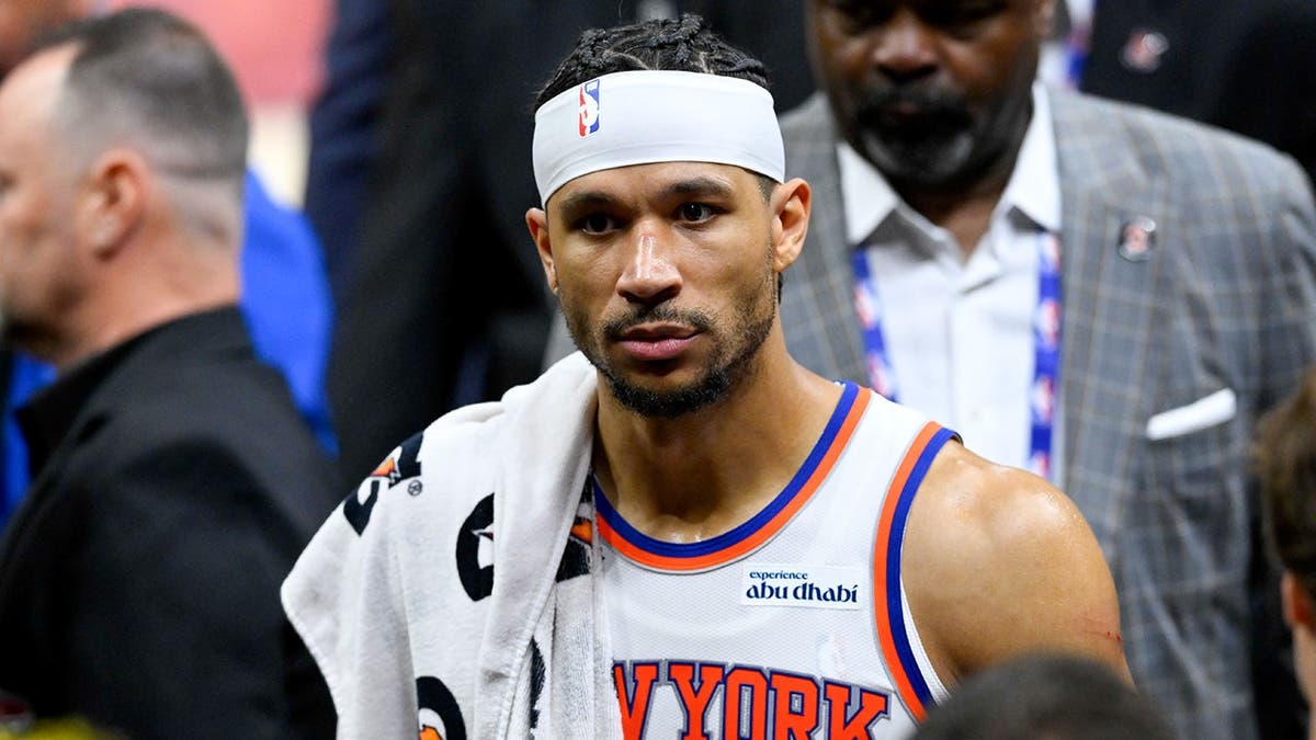 New York Knicks forward Josh Hart looking on during NBA playoff game at Rocket Arena.