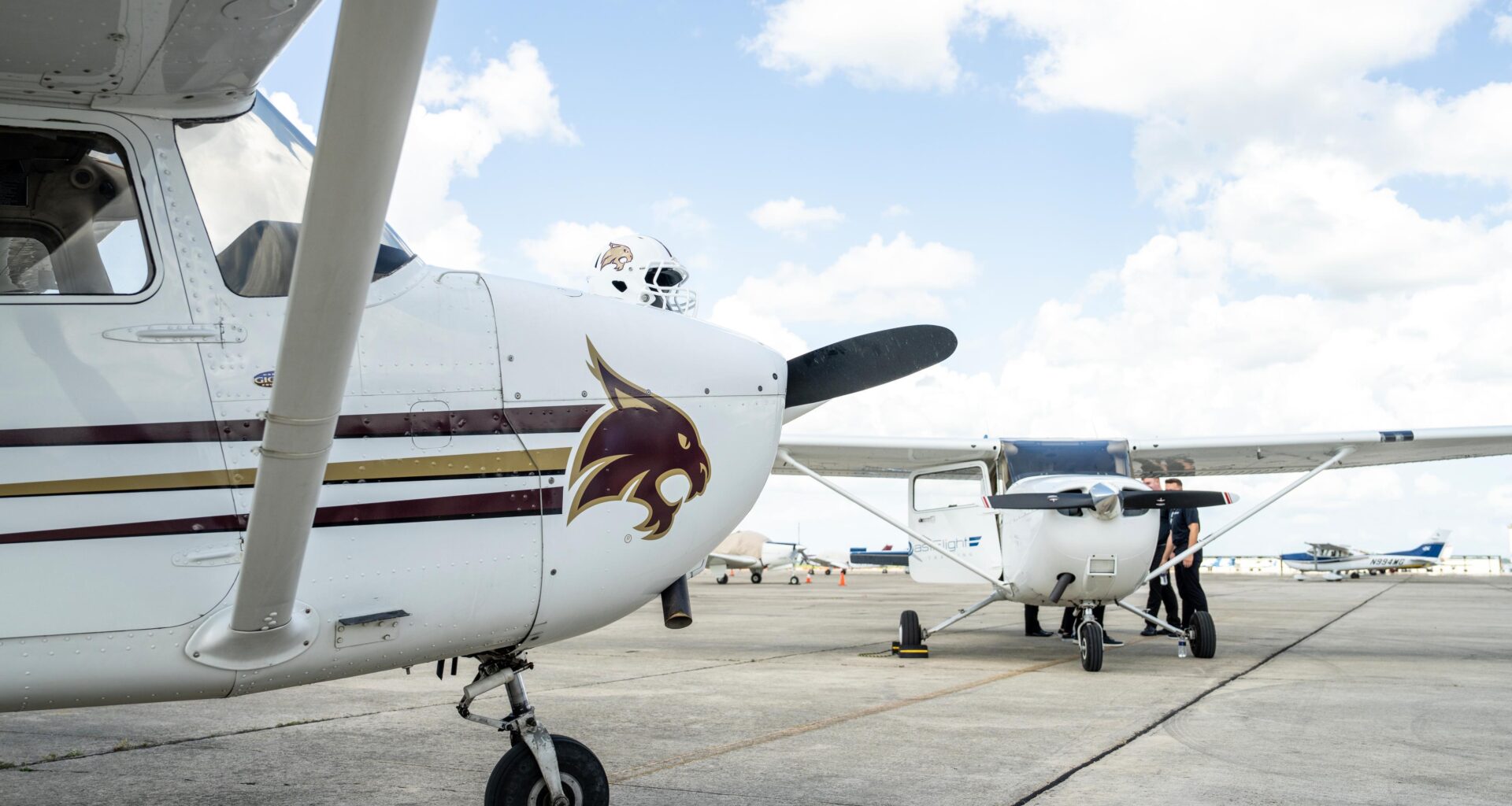 two white airplanes with txst bobcat logos