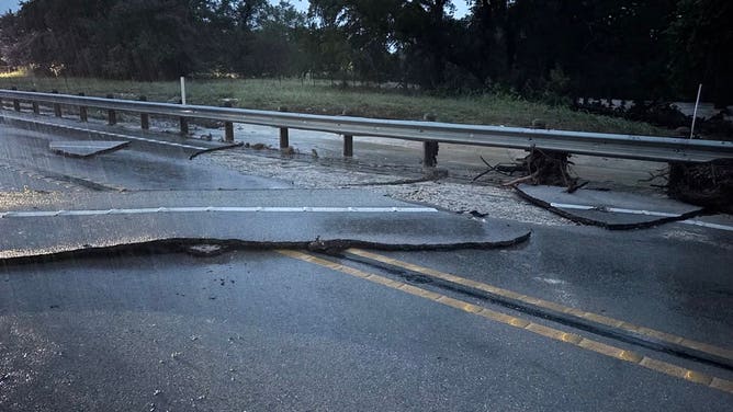 Texas flooding causes significant damage to the roadway in the Sisterdale area on Monday.