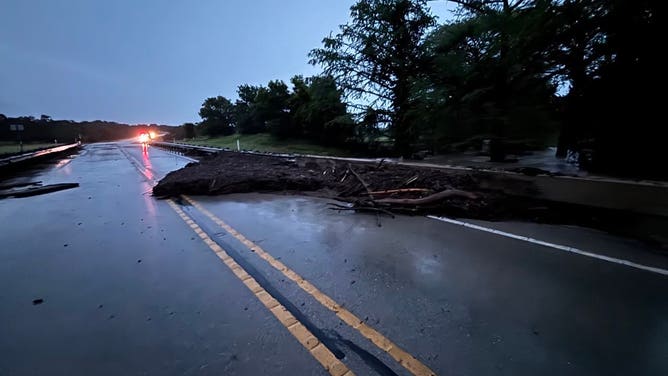 Texas flooding causes significant damage to the roadway in the Sisterdale area on Monday.