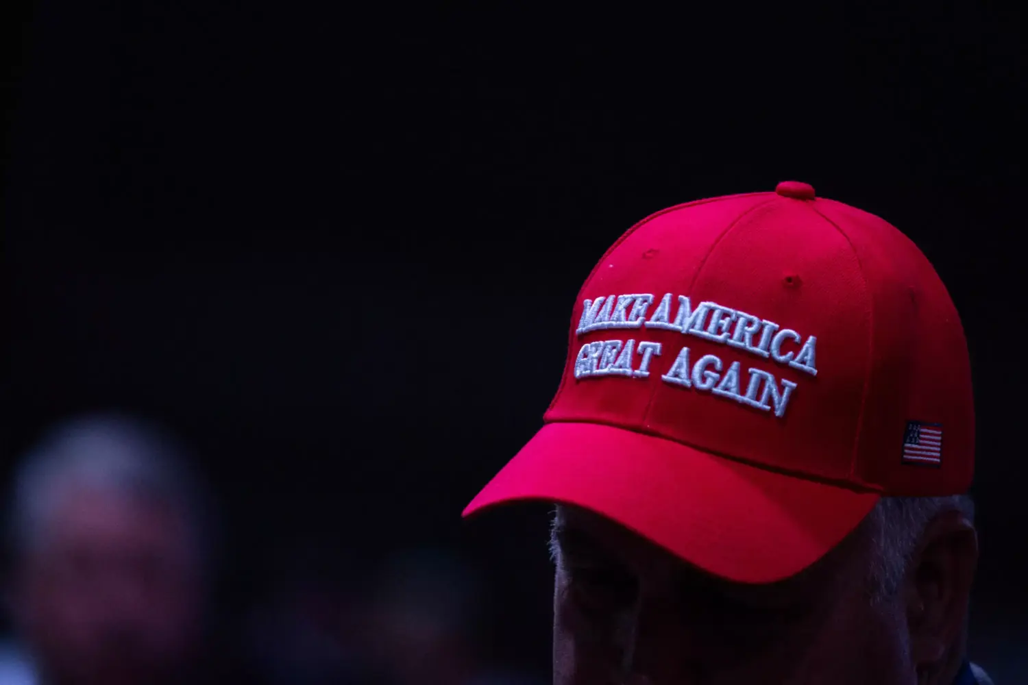 A photo of a red cap with the slogan "Make America Great Again."