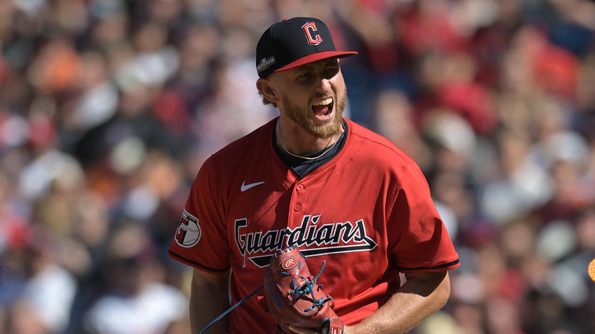 Cleveland Guardians pitcher Tanner Bibee reacting after a strikeout during a baseball game.