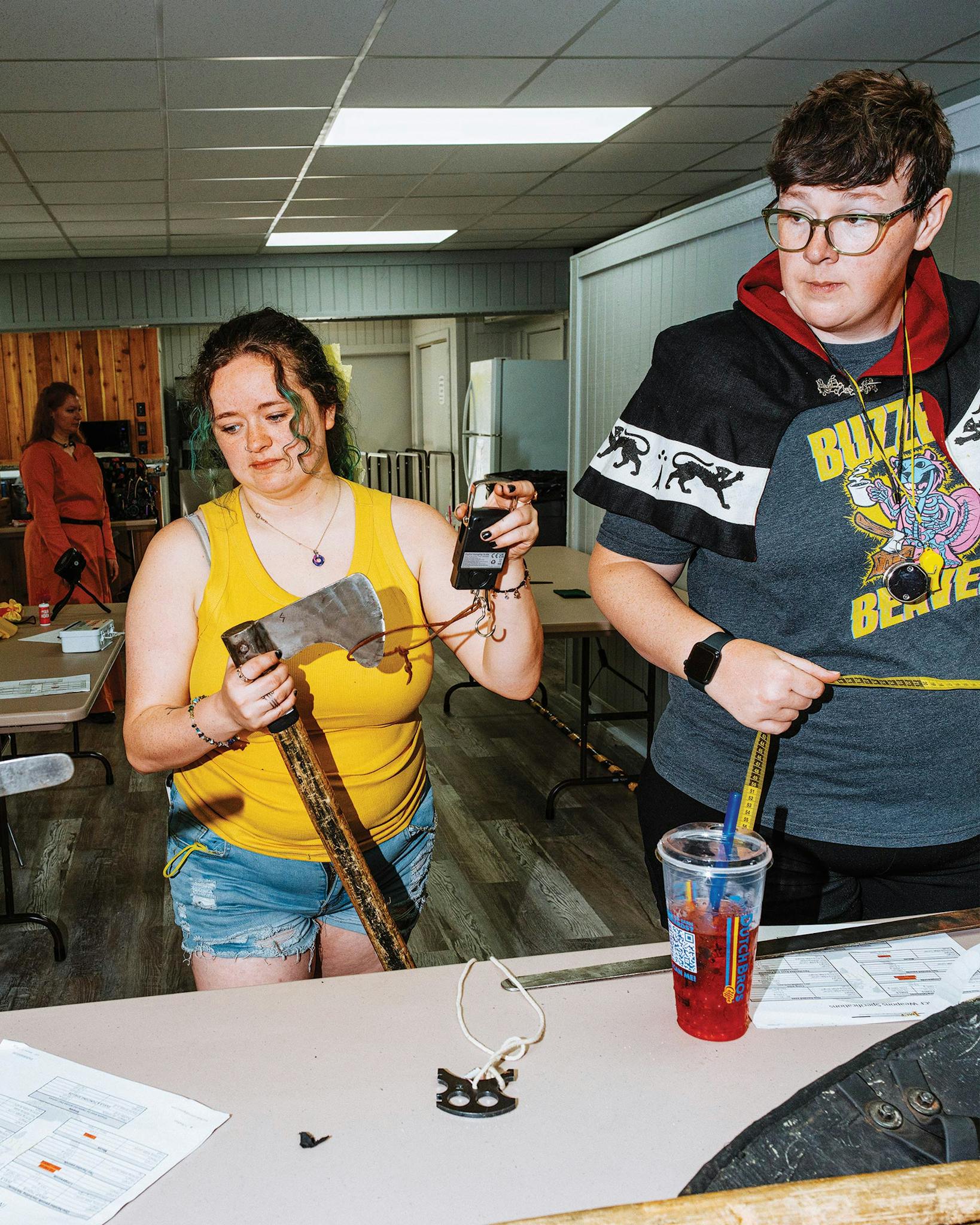 volunteers inspecting weapons before the tournament.