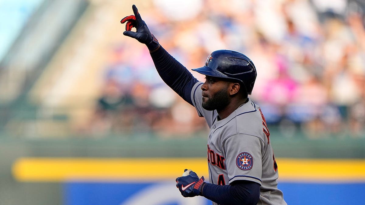 Houston Astros' Yordan Alvarez celebrating after hitting a home run during a baseball game.