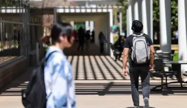 Students walk through campus March 19, 2024, at University of Texas at Dallas.