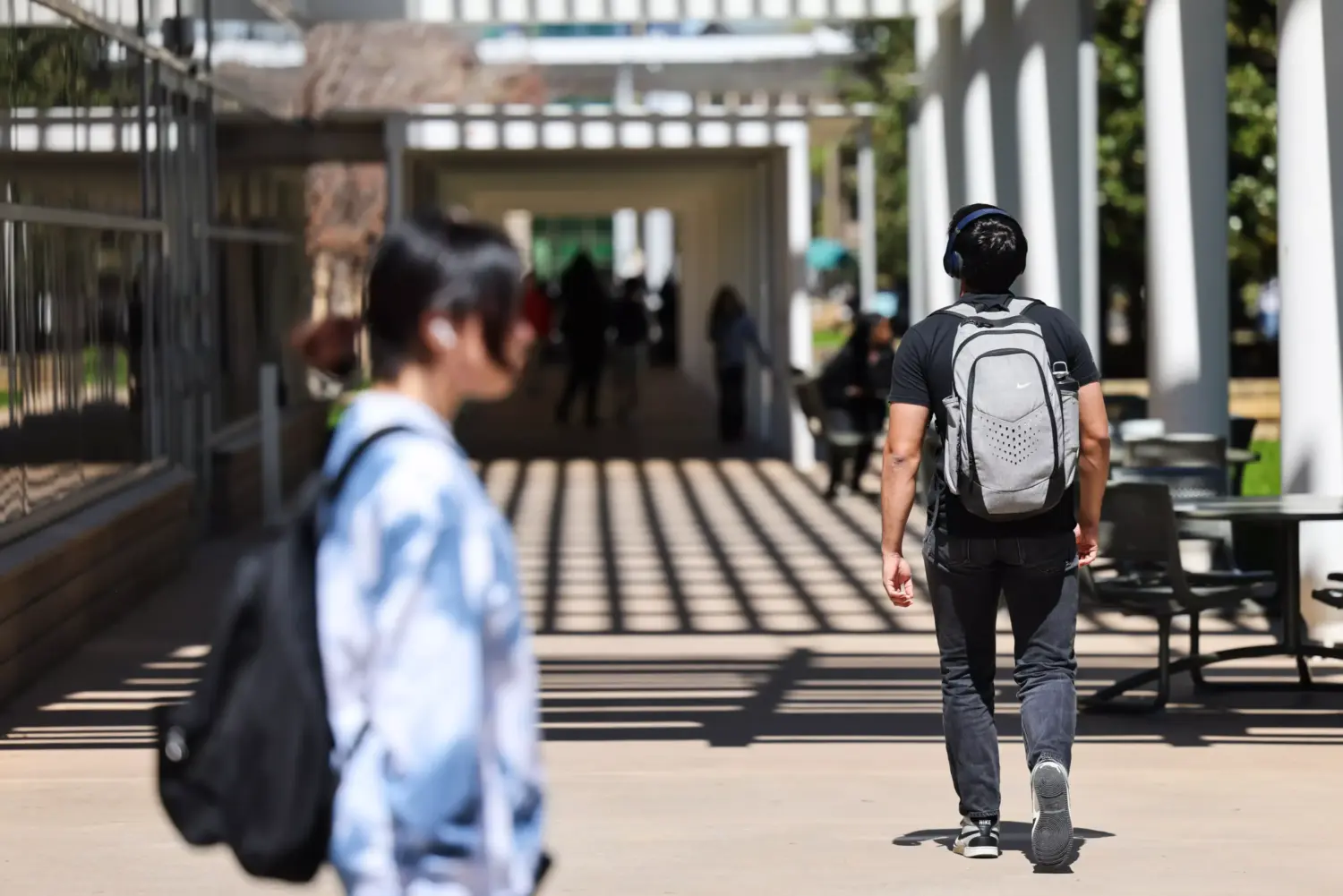Students walk through campus March 19, 2024, at University of Texas at Dallas.