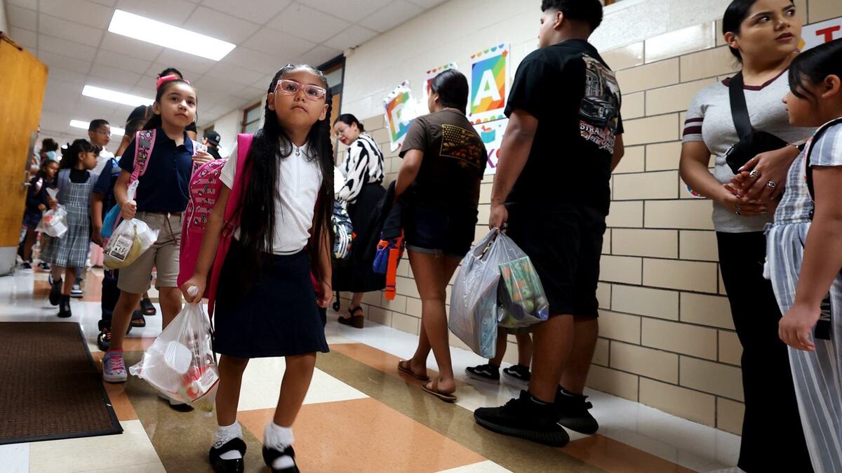 Students arrive at M.H. Moore Elementary School for the first day of school on Aug. 13, 2024. Students arrive at M.H. Moore Elementary School for the first day of school on Aug. 13, 2024.