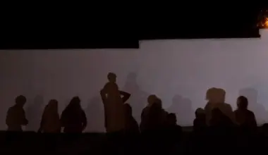 The shadows of asylum seekers are cast on a wall in Roma on Aug. 3, 2021. Roma is on the Texas/Mexico border in Starr County, about 50 miles west of McAllen.