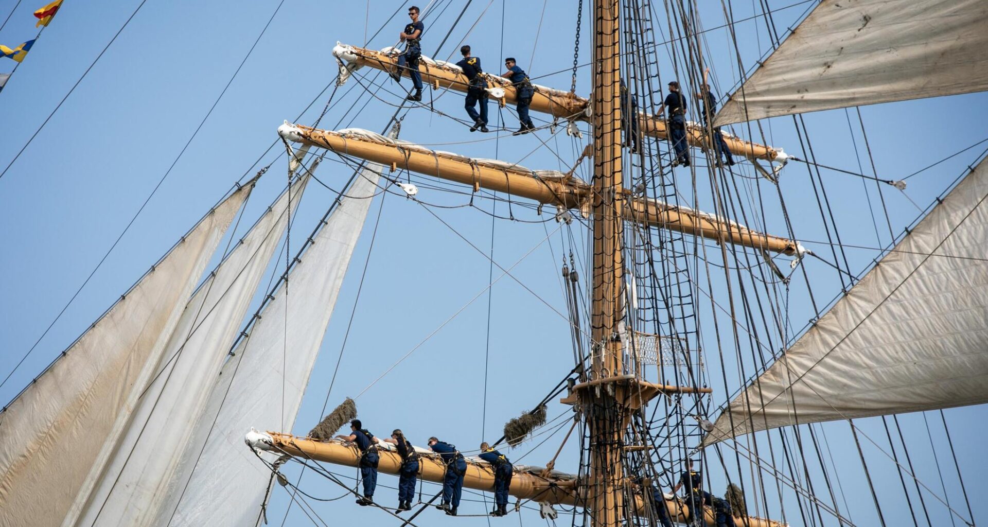 Tall ships fill Boston's outer harbor during the 2026 Parade of Sail.  (Robin Lubbock/WBUR)