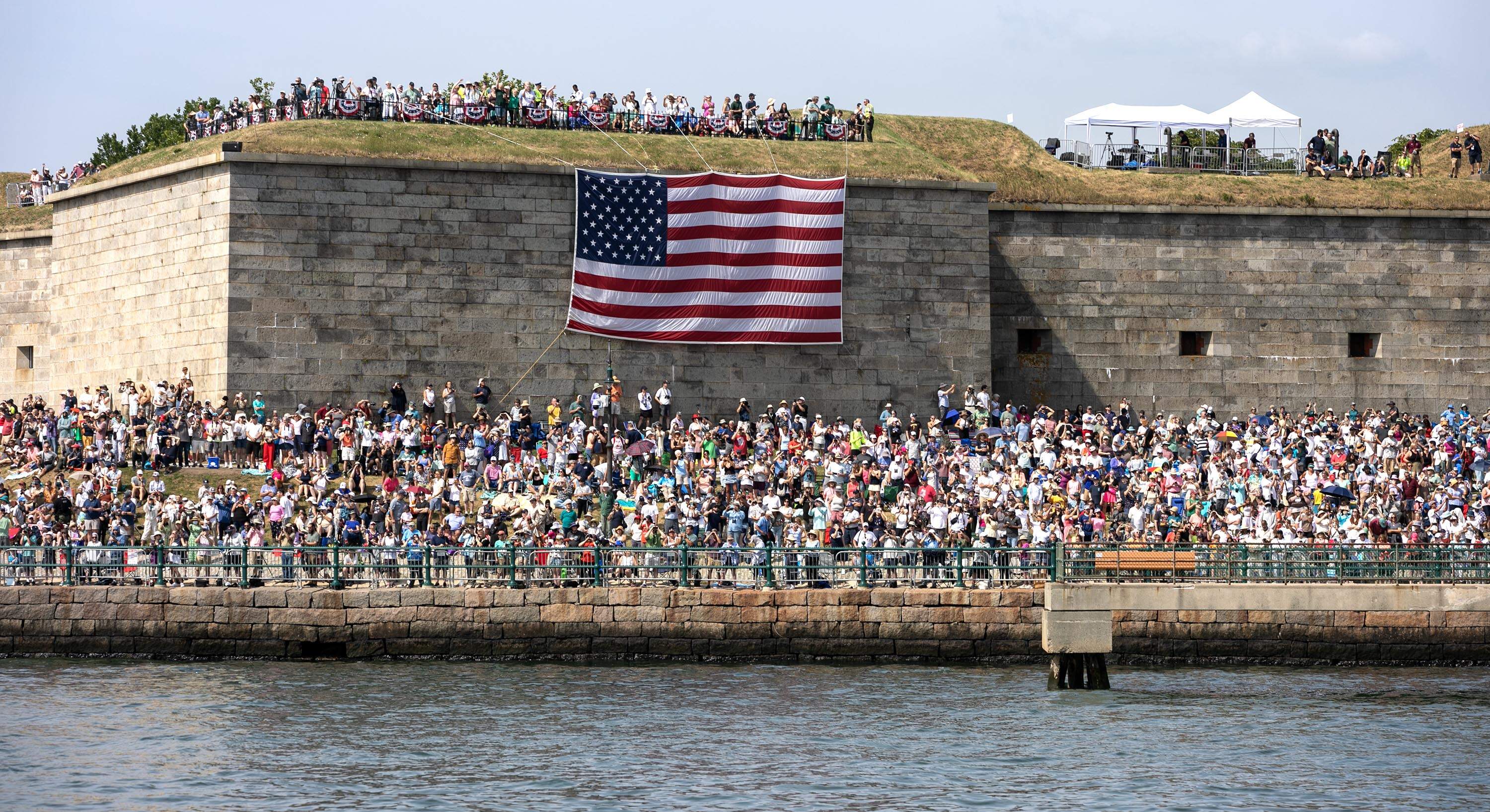Crowds gather to watch the ships. (Robin Lubbock/WBUR)