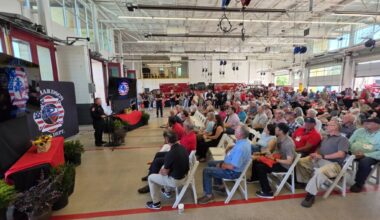 Crowd watching Fire Chief Curtis Poovey speak at the fire department's 100th anniversary celebration