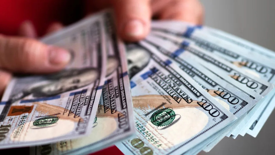 <div>FILE-In this photo illustration, $100 dollar bills are on display. (Photo Illustration by Igor Golovniov/SOPA Images/LightRocket via Getty Images)</div>