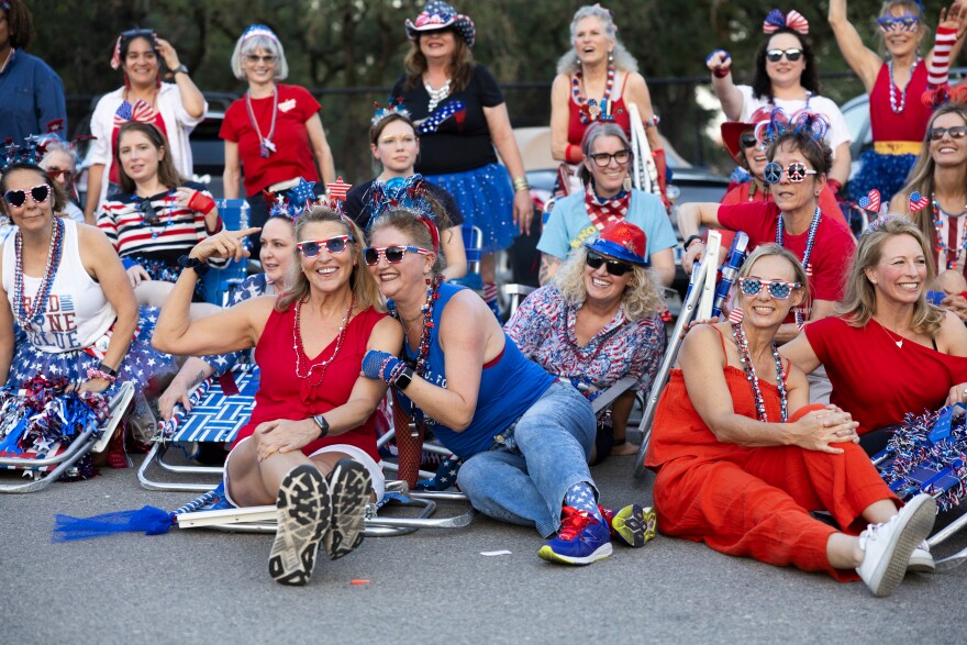 Judy Maggio and Jay Shields pose together as the lawn chair brigade takes a photo in a parking lot