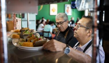 Milagro Tacos Cantina owner, Jesus Carmona, and waiter Angel Ramos serve costumers during lunchtime in Dallas, Friday, June 26, 2026.