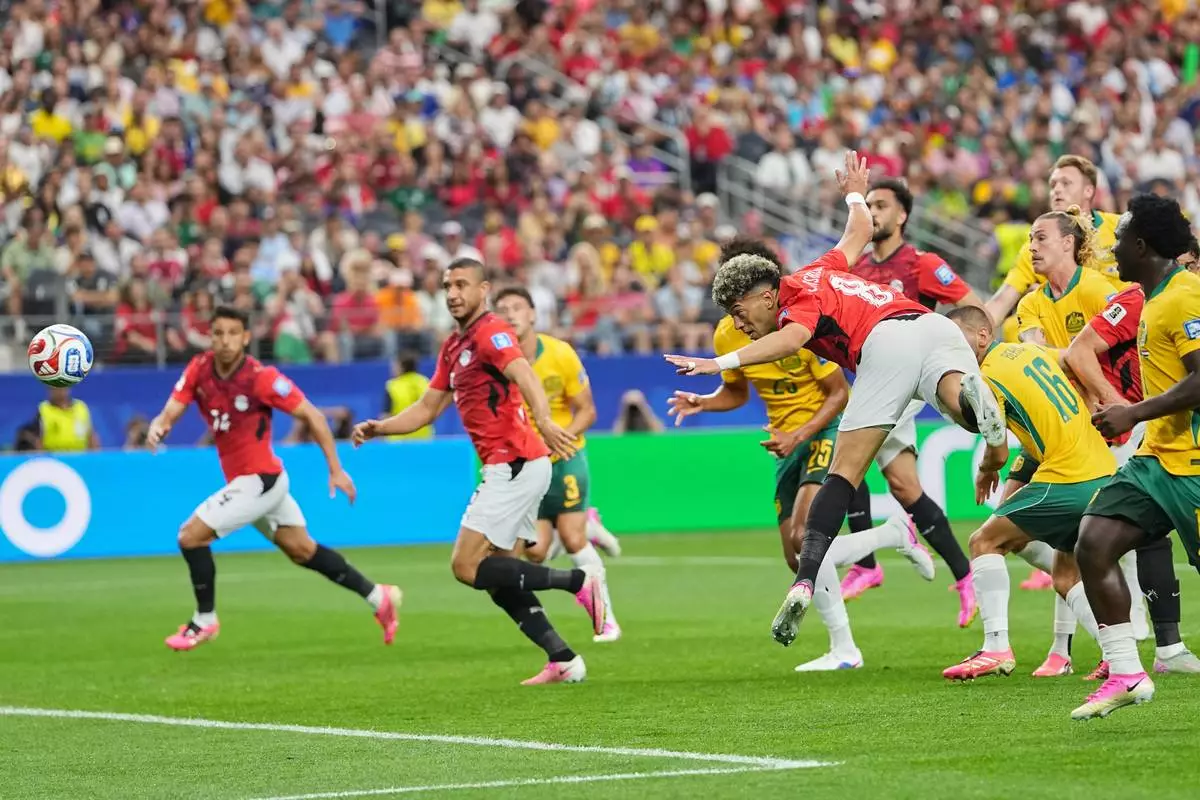 Egypt's Emam Ashour scores the opening goal during a World Cup round of 32 soccer match between Australia and Egypt in Arlington, Texas, near Dallas, Friday, July 3, 2026. (AP Photo/Julio Cortez)