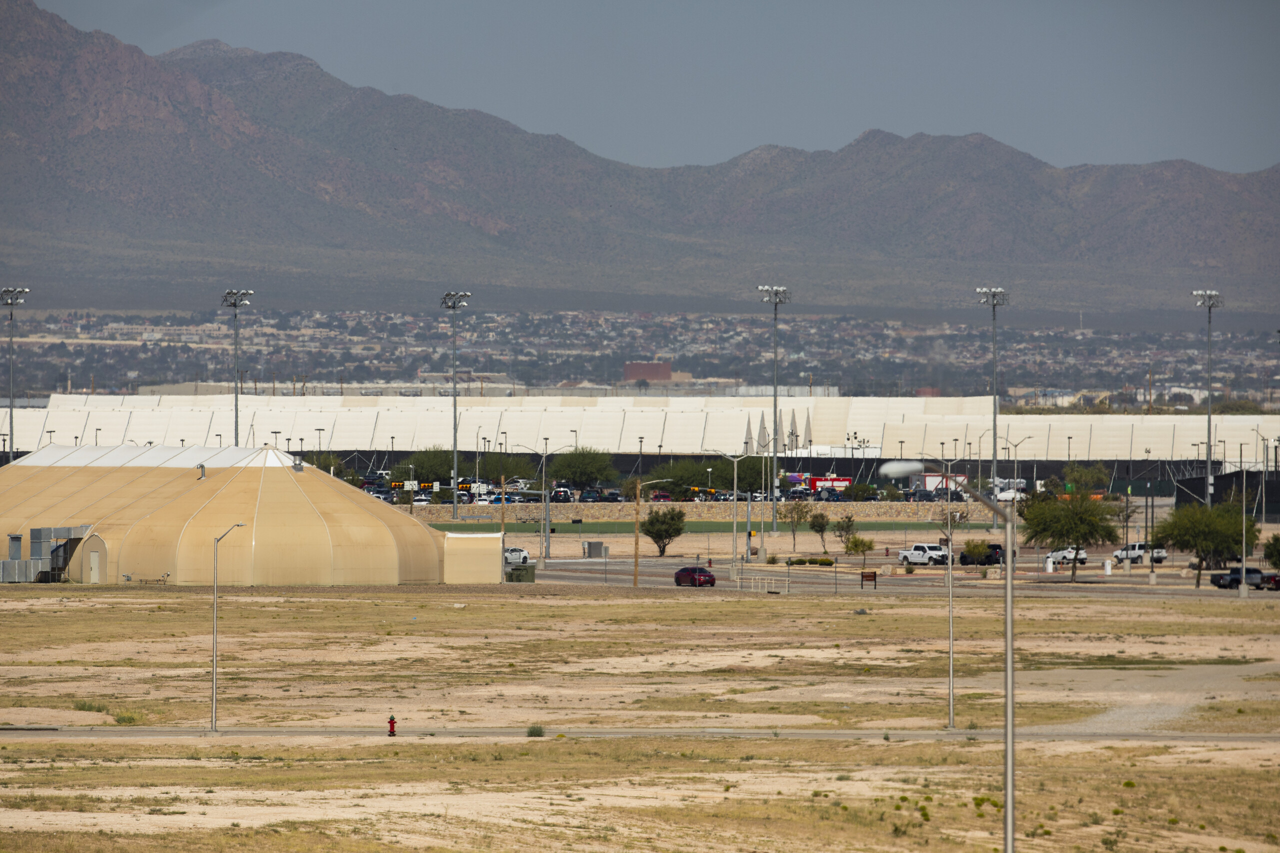 Tents house of thousands of unaccompanied migrant children as well as Afghan refugees during a Biden administration effort to reduce overcrowding at the border at the Ft. Bliss military base in El Paso on September 18, 2021.