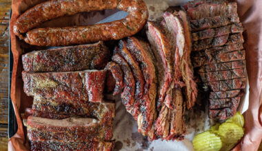 Sausage, ribs, brisket and pork steak are all displayed on a tray at Snow's BBQ on July 31, 2021 in Lexington, Texas.