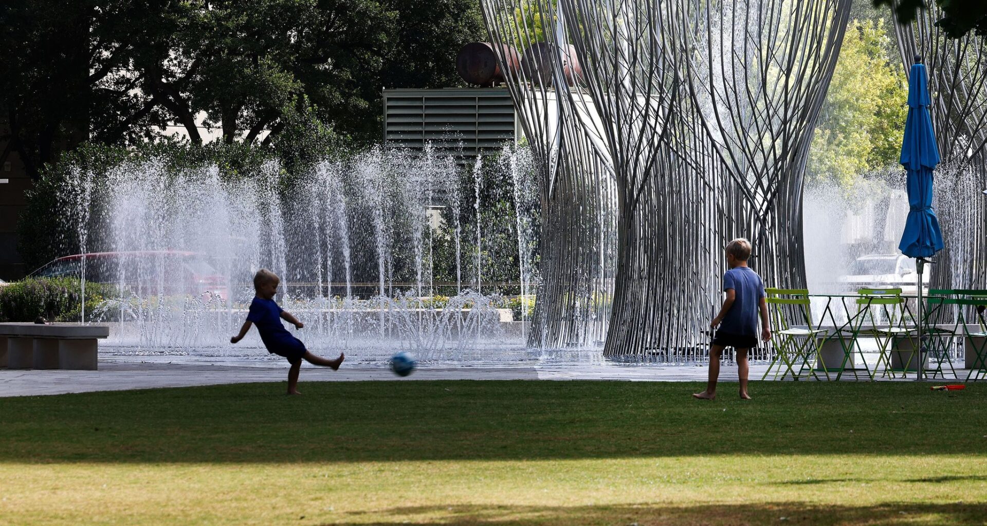 Children play soccer in Dallas' Klyde Warren Park. Isolated to scattered storms could bring a brief chance of rain to parts of Dallas-Fort Worth late Sunday afternoon.