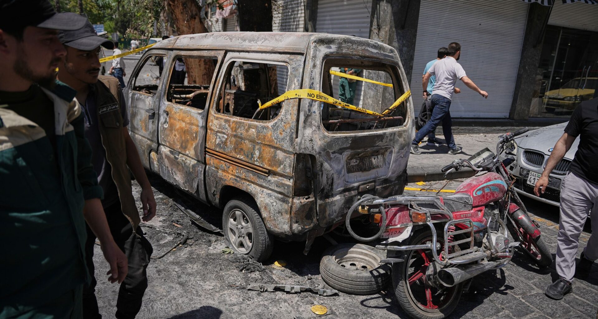 Explosions rock Syria's capital as French President Macron visits