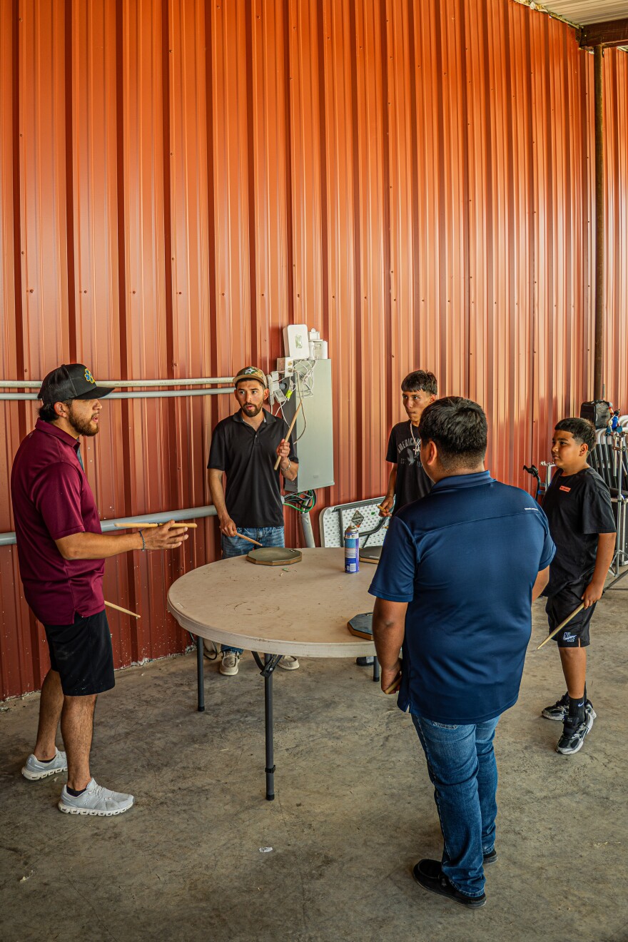Instructor Pablo Martinez, drummer for Irving-based Conjunto group Adverzo, gives tips to drum camp students (L-R) Reynold Lopez Jr, Axel Madrigal, Edwin Pichardo and David de la Cruz June 2-3 in Midlothian.