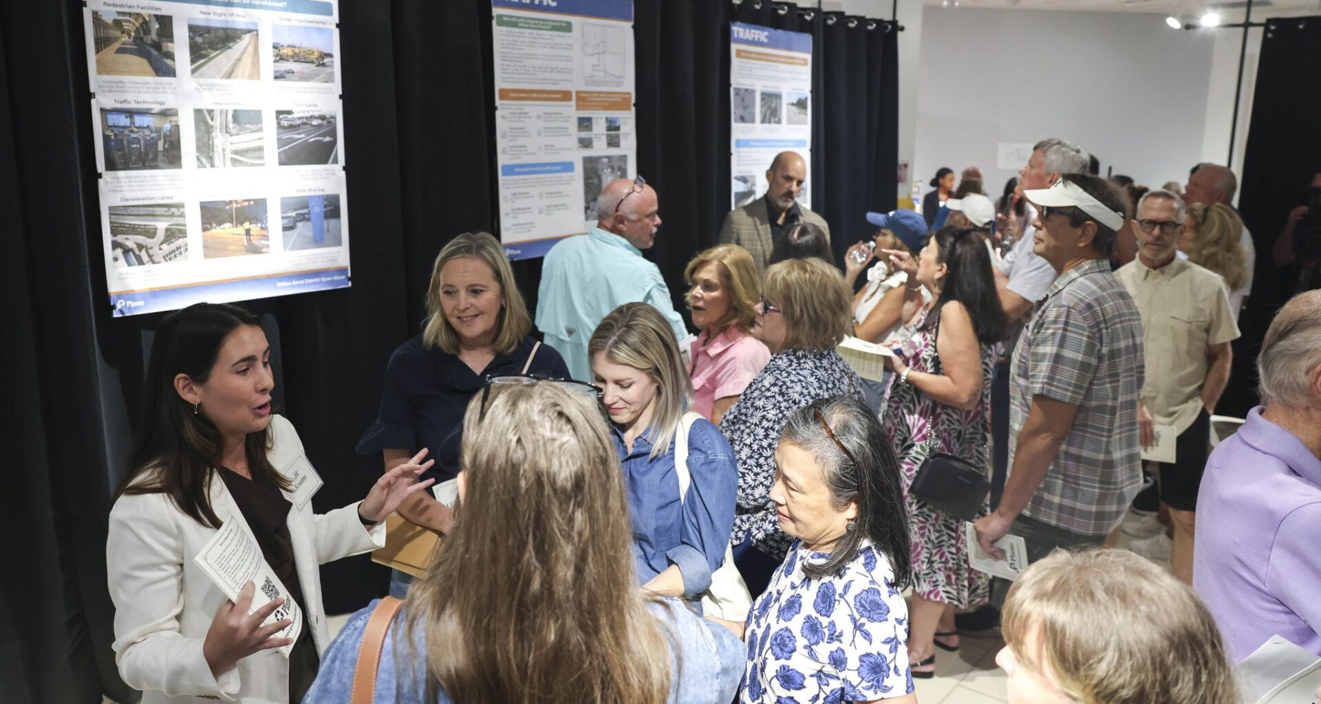 Residents gather during a community open house events regarding the Dallas Stars arena project at the Shops at Willow Bend mall, on Wednesday, July 8, 2026 in Plano.