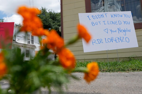 A makeshift memorial for Lorenzo Salgado Araujo, who was shot and killed by an ICE officer Tuesday, is shown Wednesday, July 8, 2026, in Houston. (AP Photo/David J. Phillip)