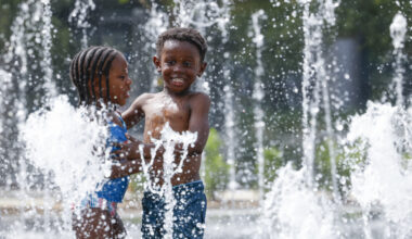 Cydney Hess, 4, and her cousin Bryson Richardson, 4, enjoy their time splashing around Nancy Best Fountain on Thursday, June 15, 2023, at Klyde Warren Park in Dallas.
