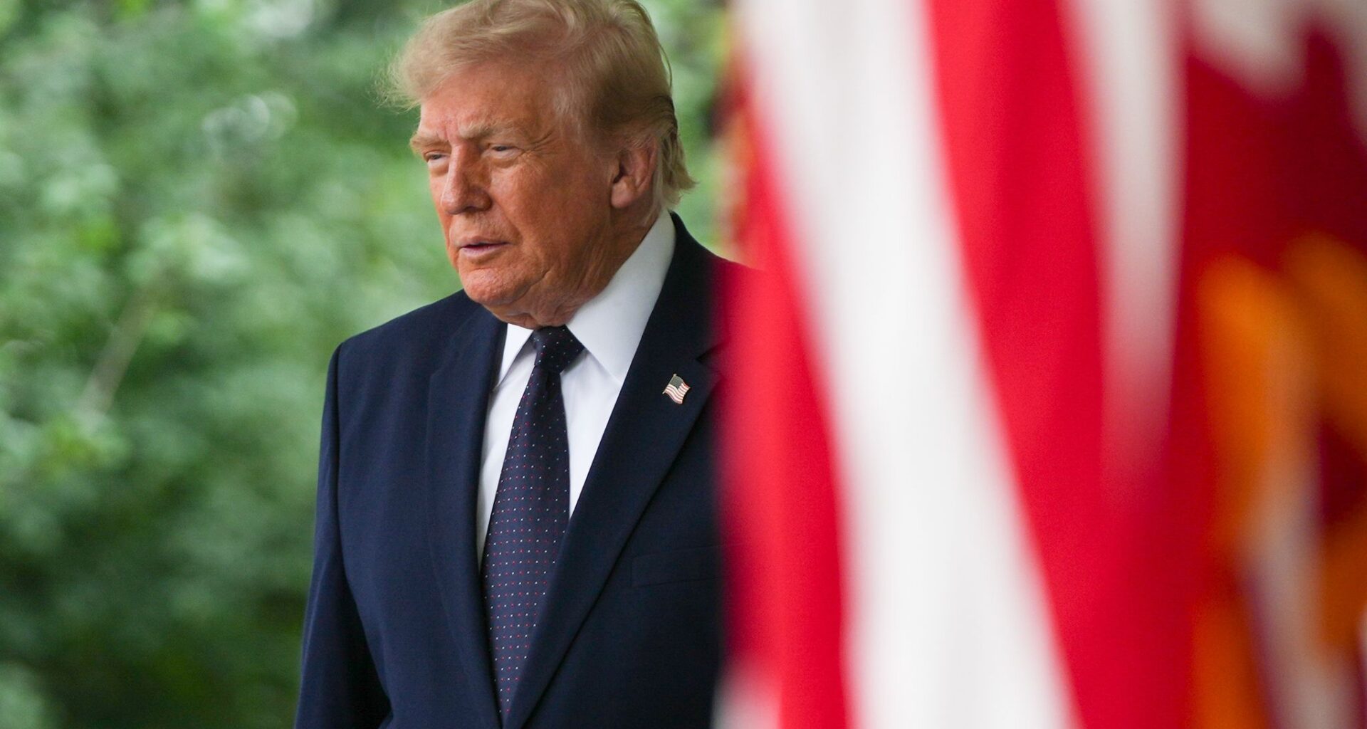 President Donald Trump arrives Monday to speak at a lunch in the White House Rose Garden.