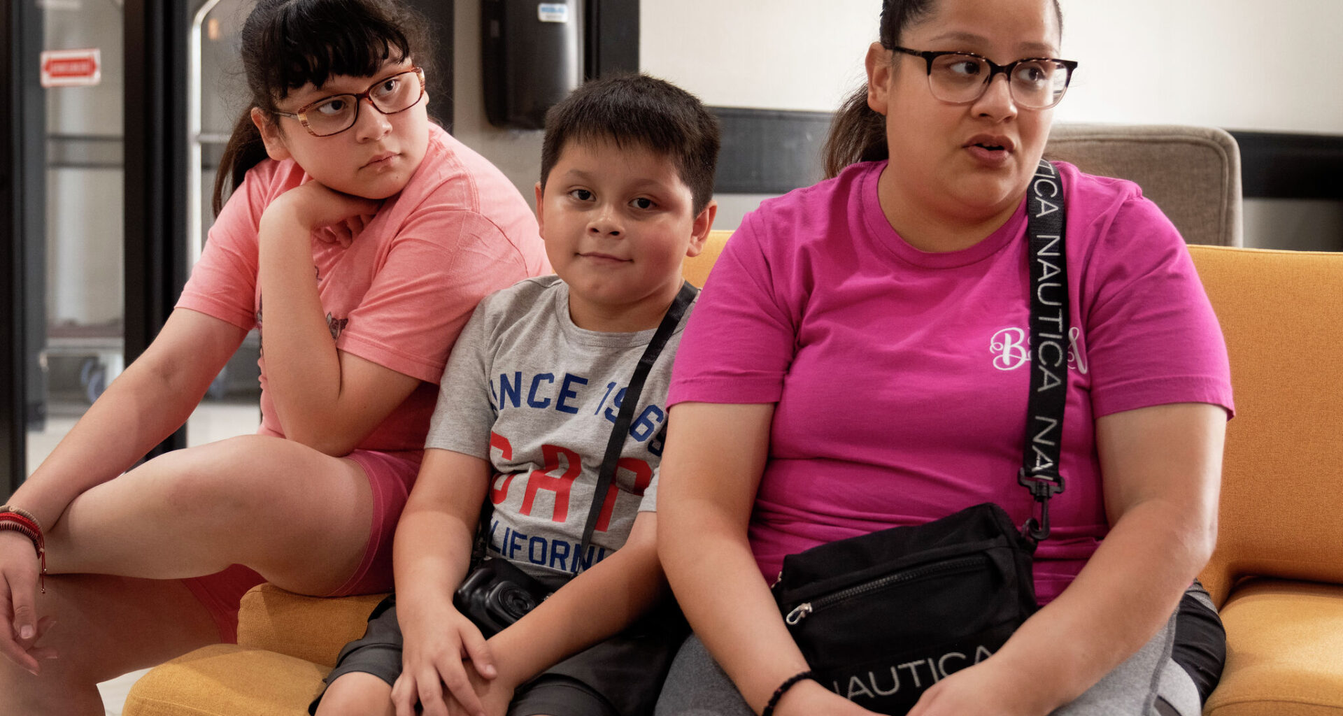Estfania Herrera sits with her two children as she talks about the lack of help from the management of The Bonnie apartments property management.