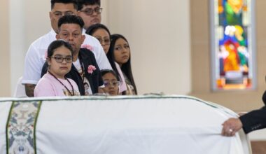 Erik and daughter Vanessa Pérez watch as the casket of Marisol and Erik Jr. Pérez who died in a late May apartment fire is wheeled past out of St. Cecilia Catholic Parish Dallas, Tuesday, June 9, 2026.